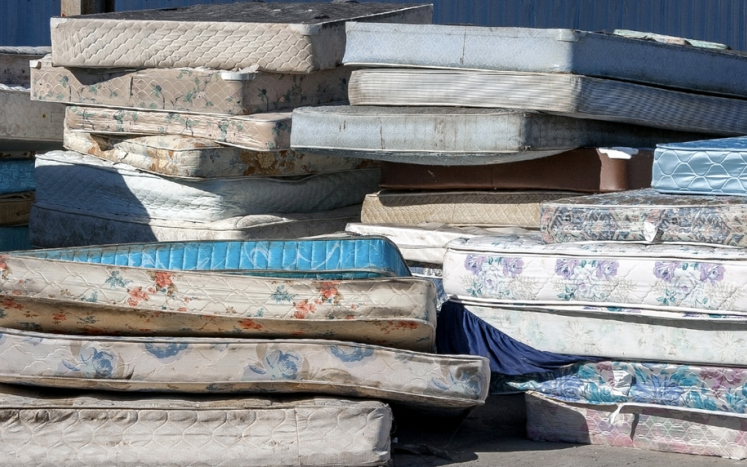 photo of junk mattresses